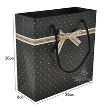 工厂直销韩式精美包装袋黑底蝴蝶结礼品手提袋中号现货混批