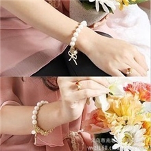 S002韩版珍珠蝴蝶结手链饰品热销成熟大方可爱韩国饰品女