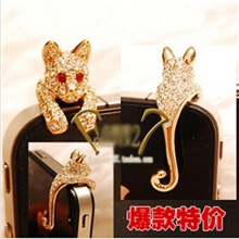 防尘塞卖疯了金钱豹小狗水钻iphone4s手机防尘塞耳机塞5955