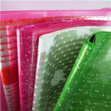 七彩夜光花包装纸地摊货源七彩人工花包装材料闪光玫瑰花包材