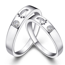 爆款925纯银情侣情节纯白铜镀白金戒指脚印钻石戒指厂家批发