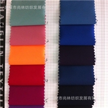 化纤面料100D四面弹中途覆膜风衣休闲布料桃皮绒现货供应