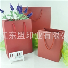 棕色210g白卡纸材质带红色尼龙袋手提购物纸袋
